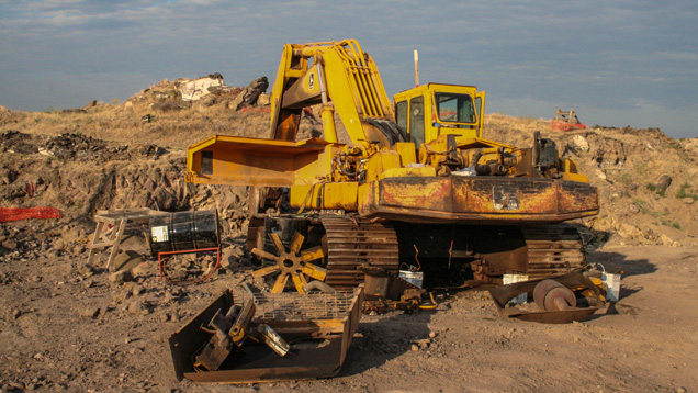 When we asked mine employee Mark Shore what it might take to fix this backhoe, he replied “about five sticks” (of dynamite!) - Duncan Pay