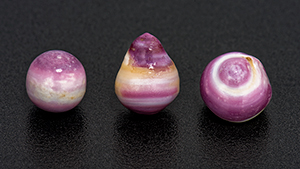 Purple and white non-nacreous pearls