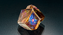 Iridescent andradite garnet from Japan with an iridescent andradite inclusion.