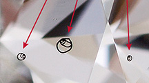CVD-grown diamond with internal laser markings.