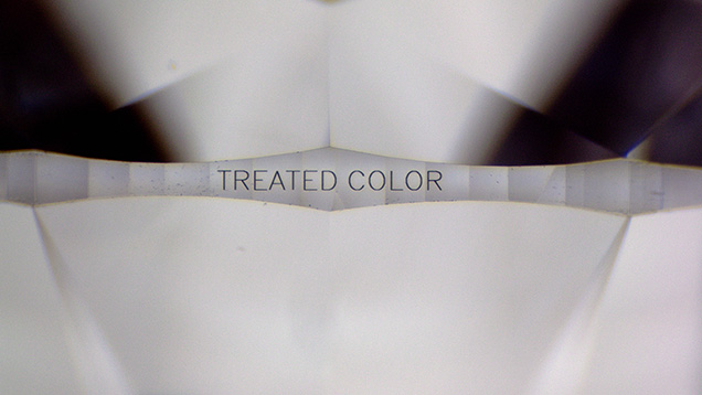 “TREATED COLOR” inscribed on the girdle of the diamond.