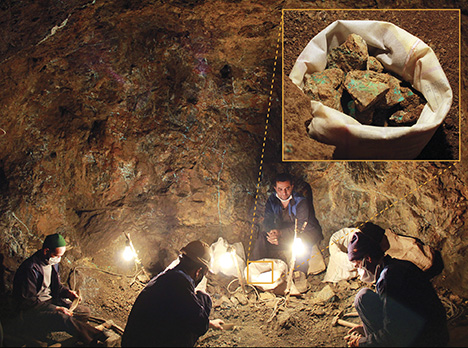 Supervisor watching as miners sort turquoise at Neyshabur