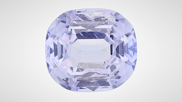 A 15.84 ct light purplish blue synthetic sapphire.
