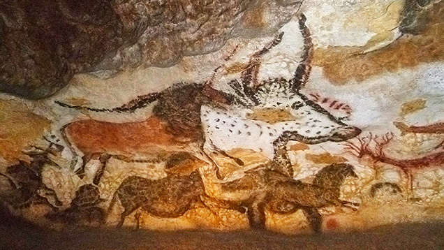 Use of red ochre in the Hall of the Bulls cave painting.