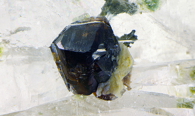 Raman identified this brownish orange crystal as cassiterite.