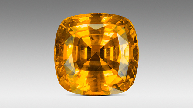 Figure 24. This unusual gem from the Bang Kha Cha deposit is colored by a high concentration of both the Fe<sup>3+</sup> and the h<sup>•</sup>-Fe<sup>3+</sup> chromophores. The color is referred to as “Mekong Whisky.” Photo by Ronnakorn Manorotkul/Lotus Gemology.