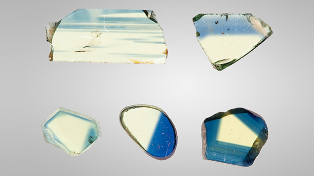 Figure 3. A selection of bicolor wafers. The weak color saturation in the yellow areas of some samples results from fabricating them thin enough that both yellow and blue areas were well within the dynamic range of the UV-Vis-NIR spectrophotometers. Photo by John L. Emmett.