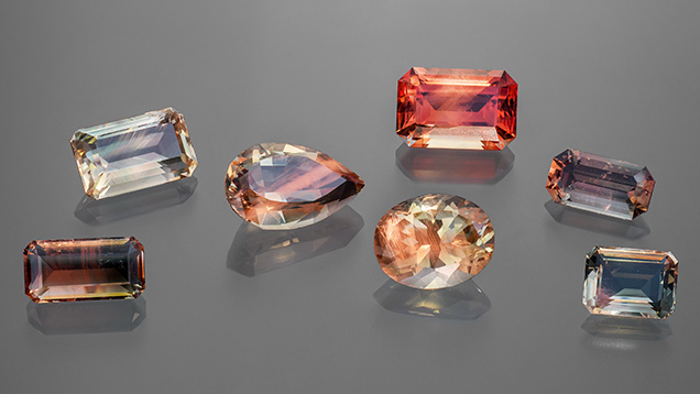 Figure 1. Faceted Oregon sunstone crystals (2.75–7.71 ct) representing the variety of colors observed. Photo by Adriana Robinson. Courtesy of the GIA Museum. Gifts of Western Ventures (pear shape), Dust Devil Mining Co. (oval), and John and Laura Ramsey (emerald cut on the far right).