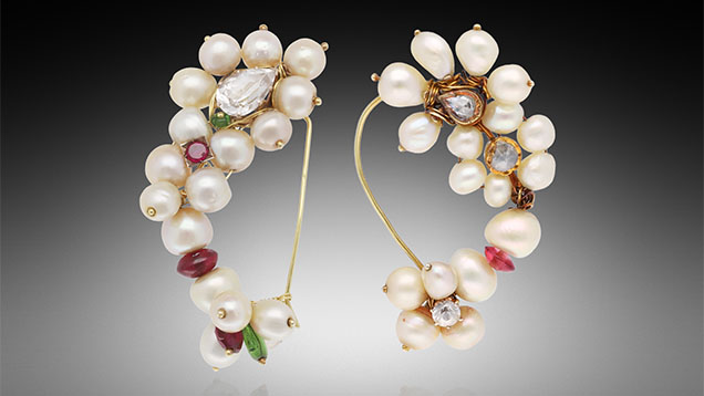 Figure 1. Two traditional Indian-style pearl nose rings (<em>nath</em>) set with colored gemstones and pearls measuring approximately 6.63 × 6.09 mm to 8.42 mm (left) and 5.38 mm to 8.02 × 7.61 mm (right). Photo by Gaurav Bera.