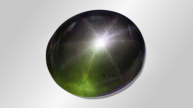 Figure 1. Eight-rayed star peridot from Myanmar weighing 34.16 ct. Photo by Karola Sieber.