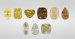 Figure 1. Yellow is the most common color in 480 nm band diamonds and can occur in different tones and saturations (top row, three on the left). The 480 nm band diamond family also includes those with brown and orange colors (top row, three on the right), as well as chameleon diamonds with a green color component (bottom row). Photos by GIA staff.