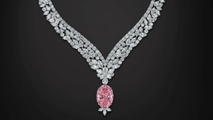 The 30.03 ct oval Juliet Pink diamond hangs from a necklace of 98.70 cts of round brilliant, pear and marquise cut colorless diamonds.