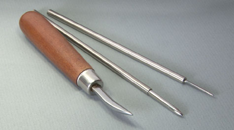 This one features a highly polished stainless steel tip with a curved, smooth surface. For ease of use, it’s mounted in a wooden handle. This tool is useful for burnishing light scratches in platinum ring shanks.