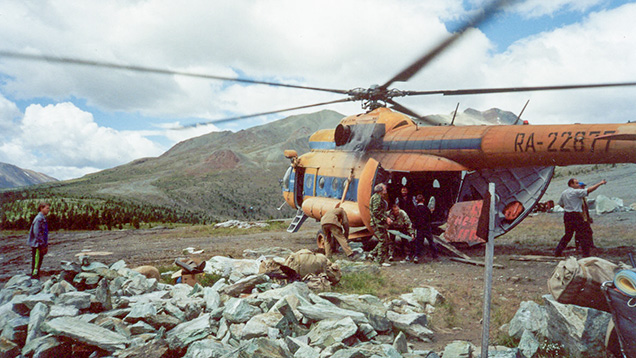 Helicopter landing in rugged Siberian terrain