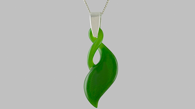 Carved nephrite pendant with graceful curves