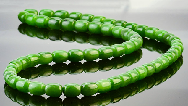 Strand of high-quality green nephrite beads