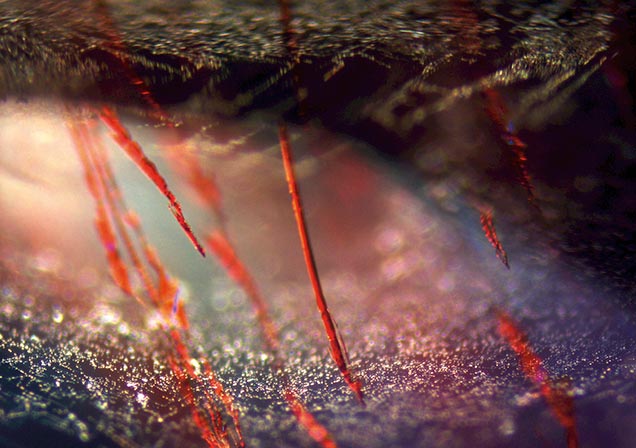 Red hematite inclusions in amethyst