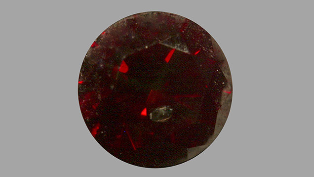 Fancy Dark red mixed type synthetic diamond.