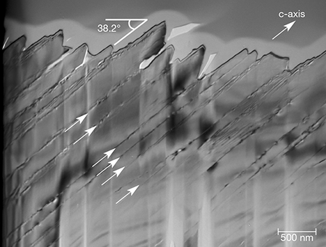 Planar defects in iridescent quartz face