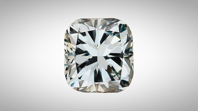 A face-up view of a cushion cut diamond with blue color.