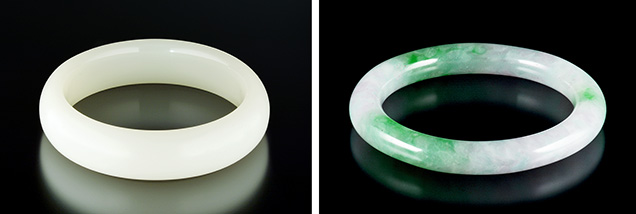 Two bangles carved from manmade glass.