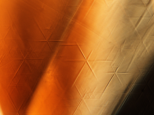 Six-rayed stars in a yellow sapphire.