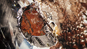 Dark orange triplite inclusion in beryl.