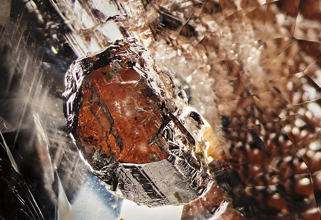 Dark orange triplite inclusion in beryl.