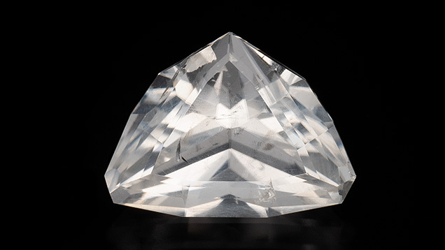 7.36 ct colorless, modified triangular brilliant-cut colemanite.