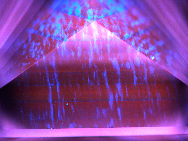 Typical orange-red fluorescence with irregular blue “banding”