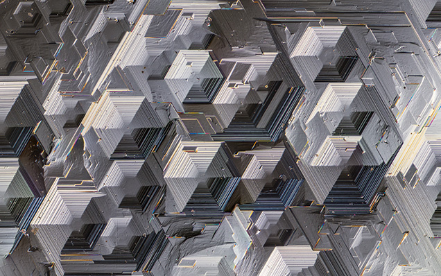 Magnified view of the complex hexagonal growth hillocks.