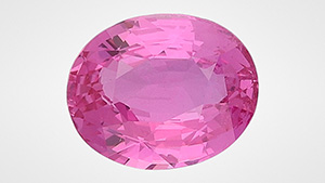 Figure 1. A 3.02 ct heated purplish pink sapphire measuring 9.57 × 7.74 × 4.55 mm. Photo by Ugo Hennebois.