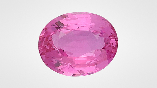 Figure 1. A 3.02 ct heated purplish pink sapphire measuring 9.57 × 7.74 × 4.55 mm. Photo by Ugo Hennebois.