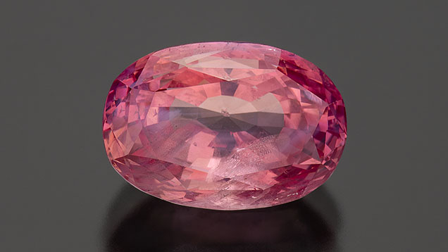 Figure 3. A 7.08 ct padparadscha sapphire. Photo by Robert Weldon; courtesy of Kreis Jewellery GmbH.