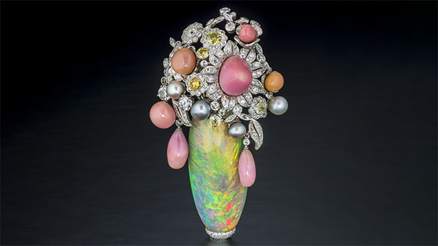 Figure 3. This pin features a 63.92 ct Ethiopian opal with 23.85 carats of conch pearl, 5.88 carats of natural pearl, and 15.85 carats of diamond, set in platinum. Photo by Robert Weldon; courtesy of Pioneer Gems of New York.