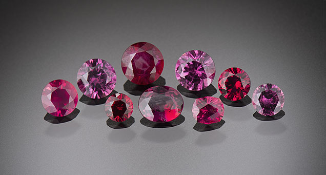 Figure 22. A suite of nine unheated rubies from the Rock Creek deposit ranging from 0.17 to 0.58 ct. Photo by Kevin Schumacher; courtesy of Jeffrey R. Hapeman, Earth’s Treasury, Inc.