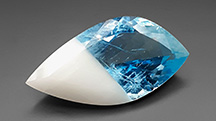 Figure 1. A 41.51 ct freeform faceted bicolor beryl. Photo by Marina Boncompagne.