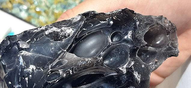 Figure 2. Detail of intact degassing bubbles in one obsidian specimen. Photo by Cristiano Brigida; courtesy of Bojo Jewelry & Minerals.