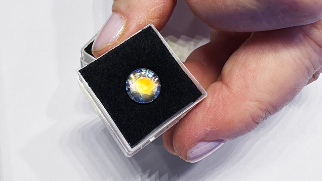 Figure 5. A 9.5 mm, 3.25 ct rainbow moonstone with orange flash and blue adularescence from Madagascar. Photo by Jennifer Stone-Sundberg; courtesy of Mayer & Watt.