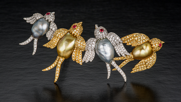 Brooch depicting swallows featuring “keshi” cultured pearls, along with diamonds and rubies.