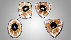 Four trapiche-like amethyst cabochons.