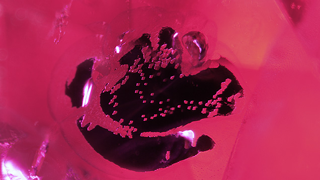 Opaque black inclusion in Mozambican ruby