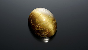 Cat’s-eye phenomenon seen in a large brownish yellow andradite.