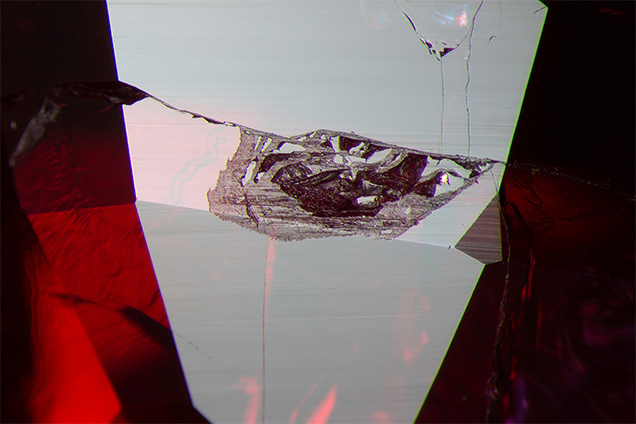 Böhmite fills a cavity in the ruby.