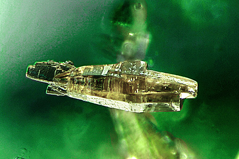 Parisite inclusions in emerald indicate Colombian origin.