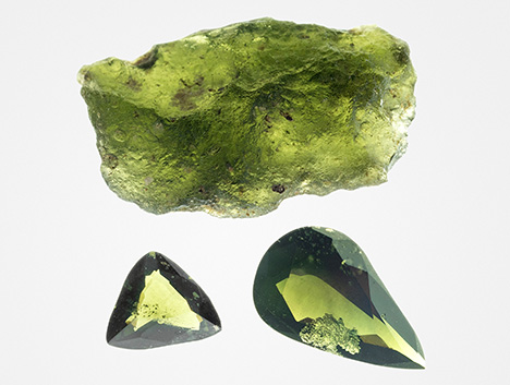 Ekanite rough and cut stones appear yellowish green in transmitted light.