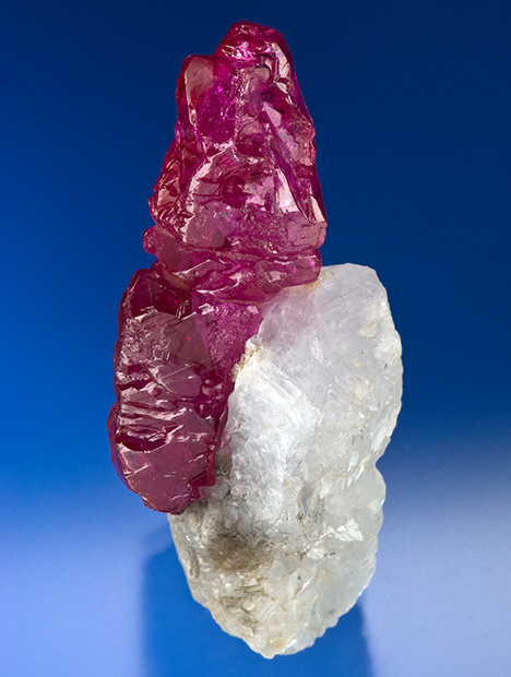 Figure 10. A 97.3 ct rough ruby crystal on calcite (marble) from Myanmar. Photo by Robert Weldon; courtesy of Pala International.
