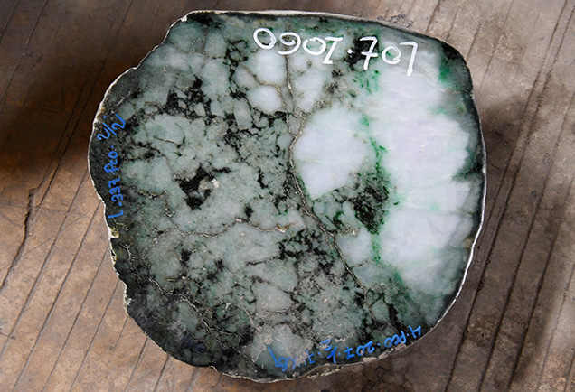 Figure 8. Rough jade boulder displaying a complex pattern not typically seen in finished gems. Photo by Wim Vertriest.