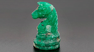 Figure 1. An imitation emerald in the form of a chess knight measuring approximately 35.05 mm in height. Photo by Kristin Reinheimer.