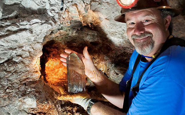 Figure 12. Daron Fisler in 2010 with a spodumene (kunzite) crystal he extracted from the Big Kahuna pocket at the Oceanview mine, Pala District, San Diego County, California. Photo by Mark Mauthner.